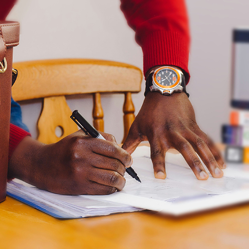 a man filling out legal papers