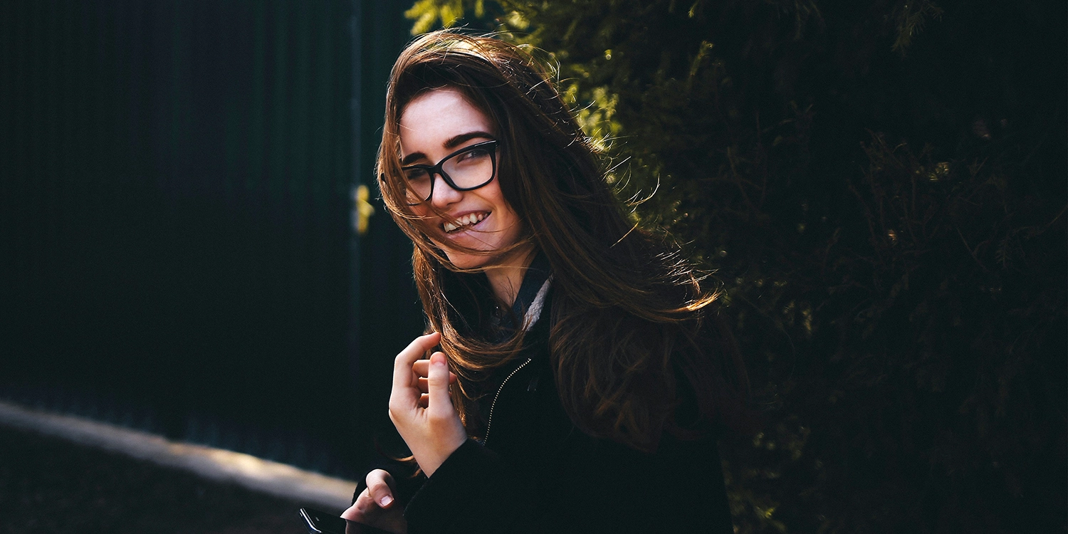 a woman smiling she is a survivor of domestic abuse