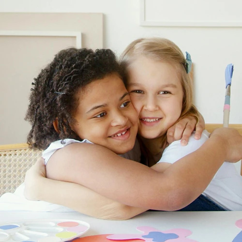 two children hugging at a CASDA children's program